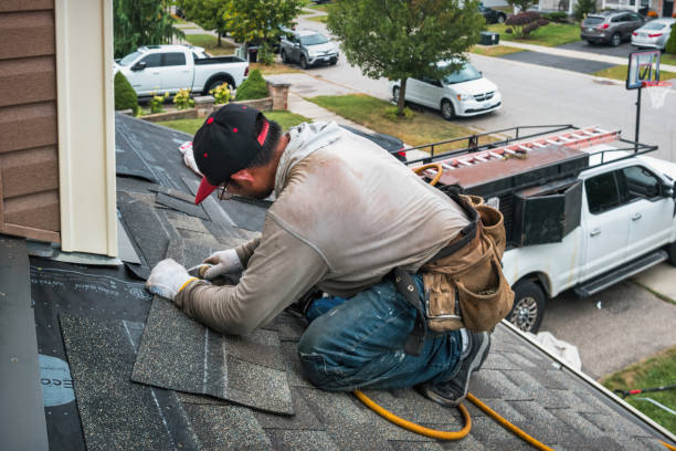 Professional Roof Replacement technician working in Newark, NY